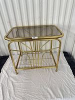 three-quarter view of side table showing glass top and frame