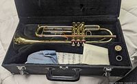 Trumpet and accessories inside open case