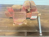 Overall view of Alltrade bench vise showing jaws, body, and swivel base