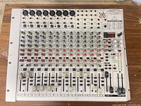 Top view of complete Behringer UB2222FX-PRO mixer showing all channels, faders and controls