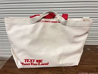 Front view showing text graphic and red handles