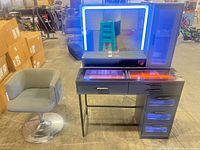 Vanity with LED mirror illuminated and swivel stool beside it
