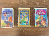 Front view of the three Disney VHS tapes