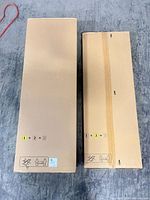 Two KALLAX cartons side by side