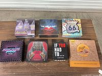 All seven boxed games on table
