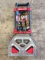 Front view of folded Milwaukee hand truck showing toe plate and frame
