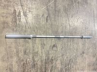 Full view of Olympic barbell on floor