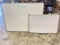 Both whiteboards side by side showing size labels and frames