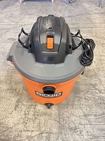 Top view of RIDGID NXT vacuum showing lid, switch, cord wrap