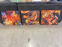All three abstract canvas paintings lined up front view