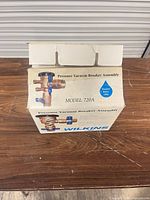 Front of Wilkins box showing model 720A and product image