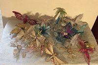 Group view of multicolor glitter butterflies displayed on a flat surface