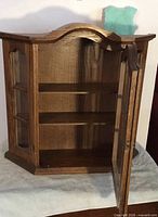Cabinet open showing shelves and interior