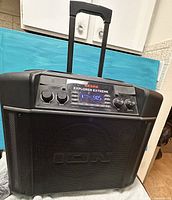 Front view of Ion Explorer Extreme speaker with handle extended showing grille and control panel