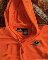 Close-up of hood interior showing Mossy Oak neck tag and fabric