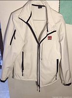Front view showing jacket design, pockets, and flag patch