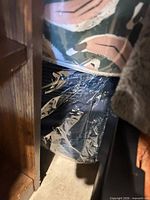 Additional packaged pillow behind shelf