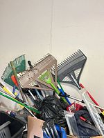 cluster of rakes and long tools showing condition and quantity