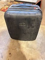 Black hard shell suitcase exterior