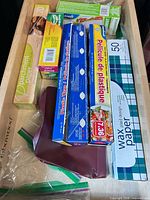 Drawer with multiple boxed kitchen wraps in original packaging