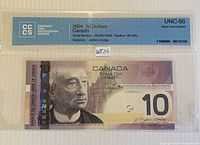 Front of CCCS-encapsulated 2004 $10 note showing grade UNC-66, serial, signatures and obverse design
