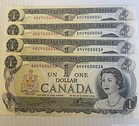 Four sequential 1973 $1 banknotes stacked showing serials AMY9050038-41