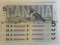 Reverse side of four sequential 1986 $5 notes showing Belted Kingfisher design and serial numbers