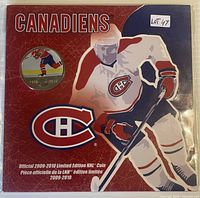 Front of sealed display card with coin and player graphic