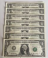 Front view of seven consecutive 2006 $1 bills showing serial numbers
