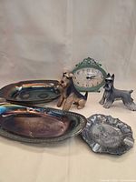 Group shot of all items: trays, clock, figurines, ashtray
