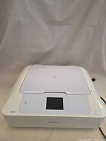 Front angled view showing overall printer exterior and touchscreen