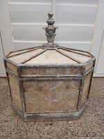 Front view of octagonal capiz shell box showing panels and metal frame