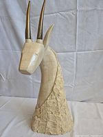 Front three-quarter view showing full sculpture and materials