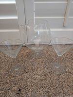 Pitcher centered with two martini glasses in front