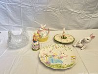 Group view showing pressed glass hen dish with separate egg tray insert