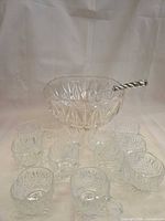 Full set: punch bowl, ladle, multiple cups