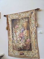 Full view of tapestry hanging with rod, tassels visible
