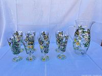Full set: pitcher plus six stemmed glasses showing painted design