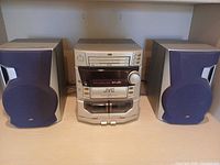 Front view of JVC MX-J50 main unit with both speakers