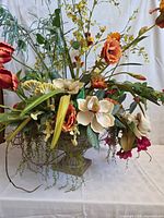 Full view of floral arrangement in urn