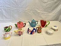 Group shot of all 11 ceramic pieces on table