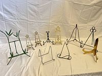 Group shot of nine easels and stands showing size and finish variety