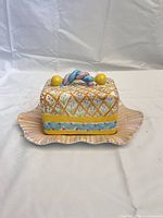 butter dish assembled, front view showing colors and wavy base edge