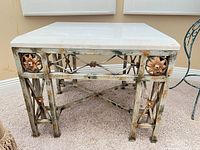 Full view of table front showing marble top and metal base