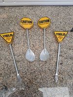 Full view of all four novelty traffic sign stirrers laid out on countertop