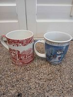 Front view of both mugs showing patterns
