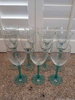Group of all six light aqua stemmed wine glasses