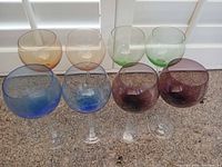 Front view of eight colored goblets
