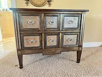 Front view showing six drawers and distressed finish