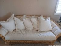 Front view of rattan sofa with cushions